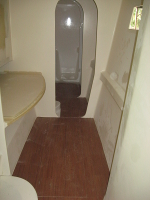 Starboard side looking forward past the office into the head