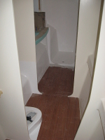 Port side looking forward through the head midships to vanity and shower