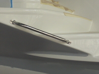 Dinghy grab rail and rub strip on starboard stern steps.